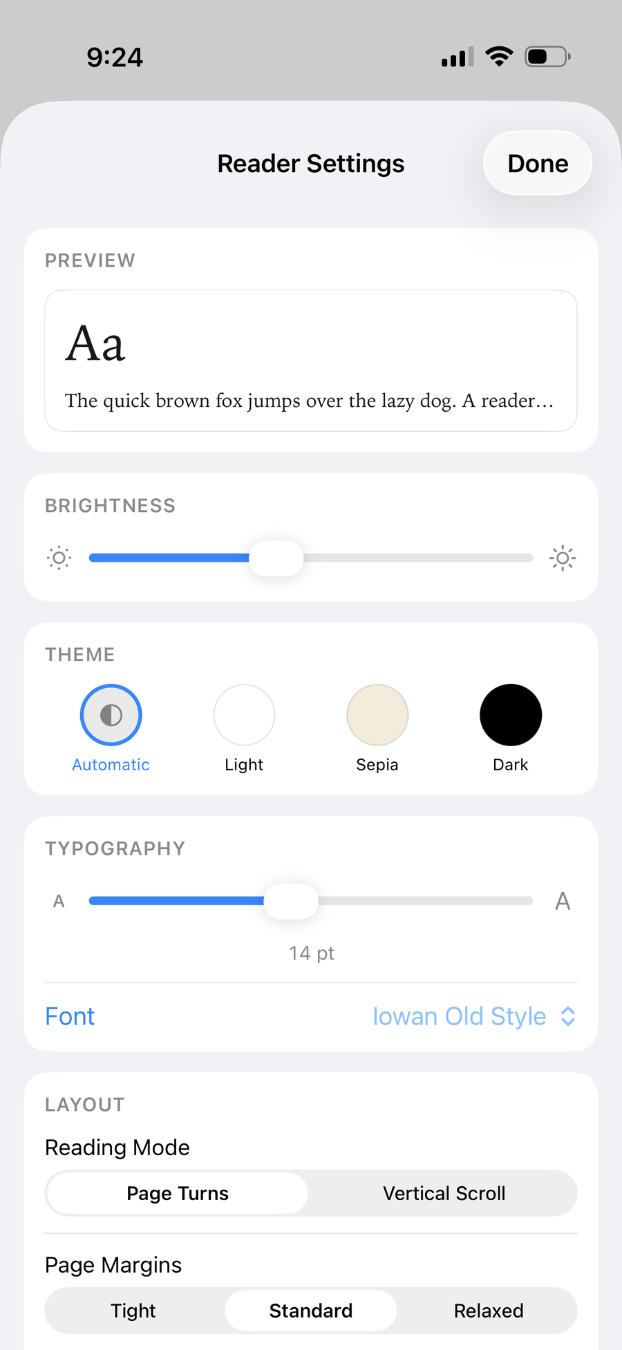 The Reader Settings sheet: a live preview, brightness, theme, typography, and layout cards